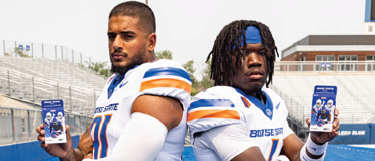 Boise State football players holding ONIT trading cards